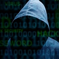 Hooded silhouette of a hacker