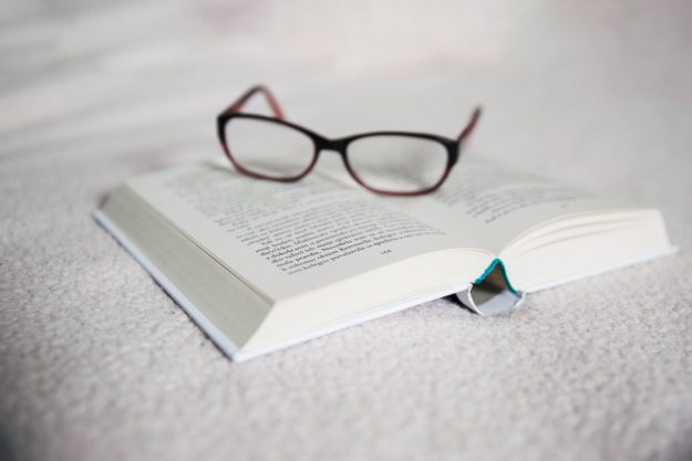 glasses-opened-book